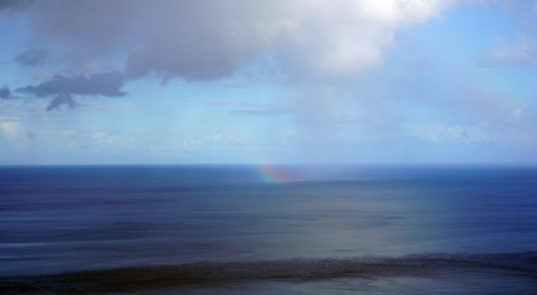 Regenbogen im Meer